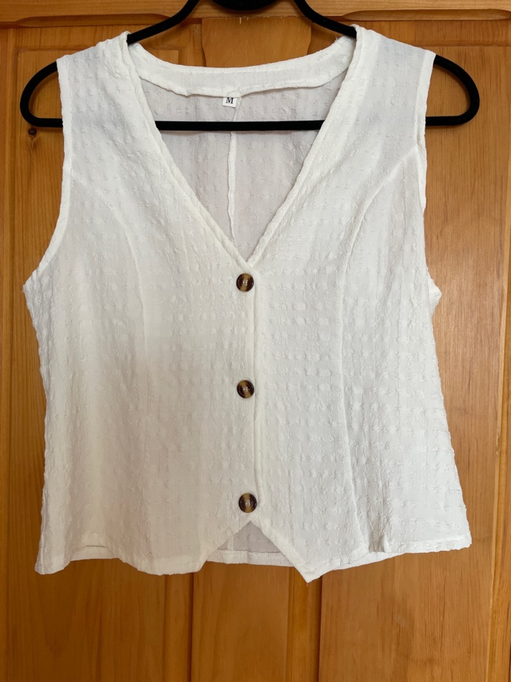 M.   Versatile Women’s White Sleeveless Button-Front Top